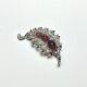 TRIFARI Alfred Philippe Rhodium Plated Red Faceted & Clear Pave' Stone Fur Clip